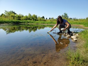 Woman taking water sample