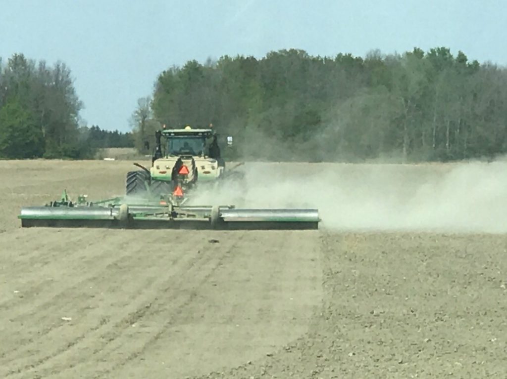 Land rolling tractor in field