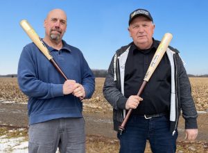 Two men with baseball bats